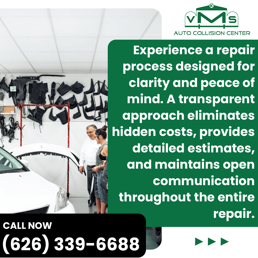 A couple talks with a technician at the VMS Auto Collision Center reception desk, looking at a white car. The scene emphasizes a clear, transparent repair process with no hidden costs.