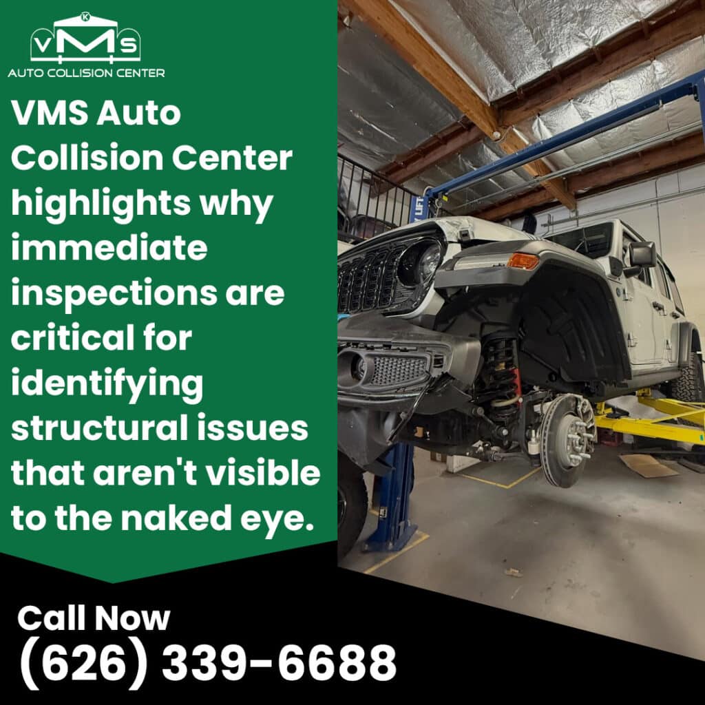 Damaged Jeep on a lift at VMS Auto Collision Center during a structural damage inspection after a collision.