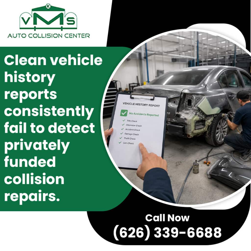 A hand pointing to a clean vehicle history report showing no accidents reported while a technician repairs body damage on a sedan in the background.